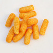 Close up of orange cheese puffs