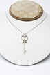 18k white gold key pendant with 0.50 carat diamonds