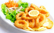 Deep batter fried squid rings calamari with green salad Deep batter fried squid rings calamari with green salad