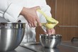 Mid- adult chef squeezing lemon