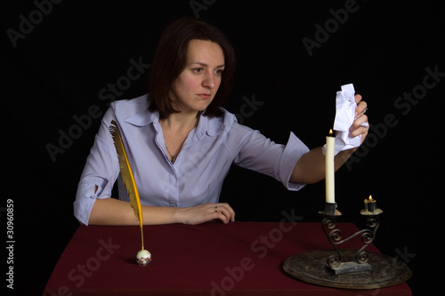 Photo: portrait of beautiful brown-haired girl writing work portrait of beautiful brown-haired girl writing work