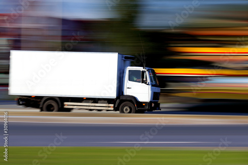 Photo: White truck on road is going White truck on road is going