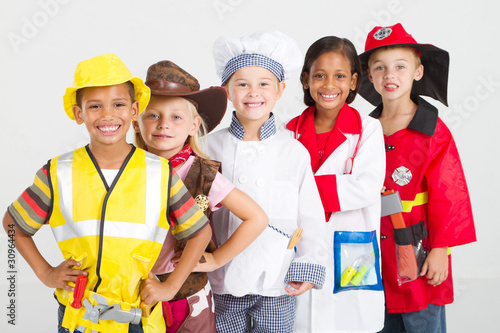 Photo: kids in various uniforms standing in a line kids in various uniforms standing in a line