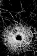 broken glass isolated on black - bullet hole gunshot