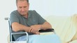 Man in a wheelchair thinking Man in a wheelchair thinking