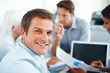 Smart young businessman with colleagues in meeting