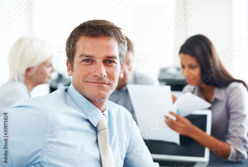 Photo: Successful businessman taking break from meeting Successful businessman taking break from meeting