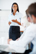 Young businesswoman discussing project with colleagues