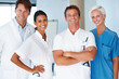 Group of successful young doctors standing together