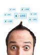 Young man with LIKE sign over his head