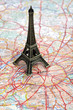 Statue of Eiffel Tower on map of Paris
