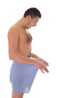 Foto: Young sexy handsome man looking in his pants Young sexy handsome man looking in his pants
