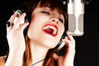 young artist woman recording in a studio