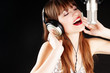 expressive woman singing to the microphone