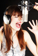 expressive woman singing to the microphone expressive woman singing to the microphone