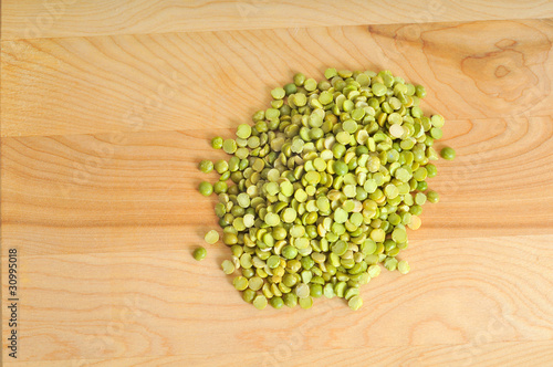 Photo: Split peas in a small pile on a cutting board Split peas in a small pile on a cutting board