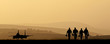 Silhouette of military attack aircraft against vibrant sunset sk