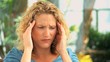 Curly haired woman having an headache
