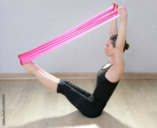 Photo: pilates yoga resistance band red rubber gym woman pilates yoga resistance band red rubber gym woman