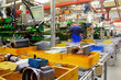 industrial assembly hall, electric motors, in motion