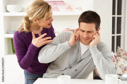 Photo: Couple Having Argument At Home Couple Having Argument At Home