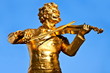 Golden statue of Johann Strauss in vienna Golden statue of Johann Strauss in vienna