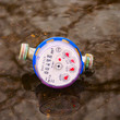 Water meter in the puddle