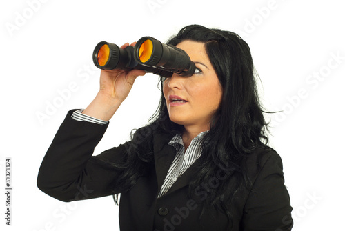 Photo: Business woman looking through binocular Business woman looking through binocular
