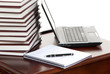 work place  laptop, pen, notebook on a table