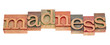 madness word in letterpress type