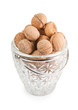 walnuts in the crystal vase isolated on white
