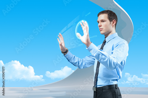 Photo: Businessman using futuristic hologram interface keyboard Businessman using futuristic hologram interface keyboard