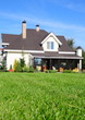 a new house with its garden under blue sky a new house with its garden under blue sky