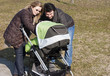 Happy Family Walking with Stroller