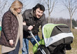 Happy Family Walking with Stroller