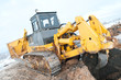 bulldozer loader at winter frozen soil excavation works