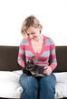 Young woman with two rabbits on her laps
