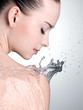 Profile portrait of beautiful woman with water on body