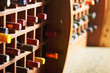 Wooden cells with wine bottles