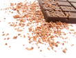Bar of chocolate and chocolate chips on white