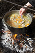 Preparing food on campfire