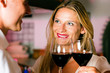 Man and woman flirting in hotel bar