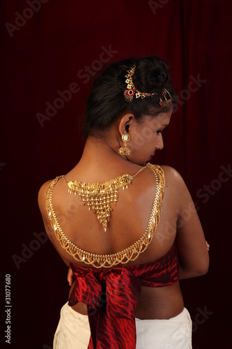 Photo: girl with gold ornaments on nude back girl with gold ornaments on nude back