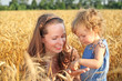 Woman with child in field Woman with child in field