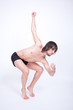 Young attractive man dancing in studio