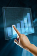 a woman hand make a graph on a digital screen