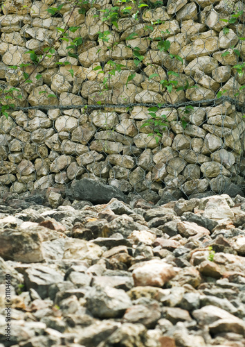 Photo: Stone wall and stone covered ground Stone wall and stone covered ground