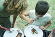 Photo: Two boys eating grilled meat Two boys eating grilled meat