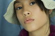 Teen girl wearing sun hat, close-up, portrait