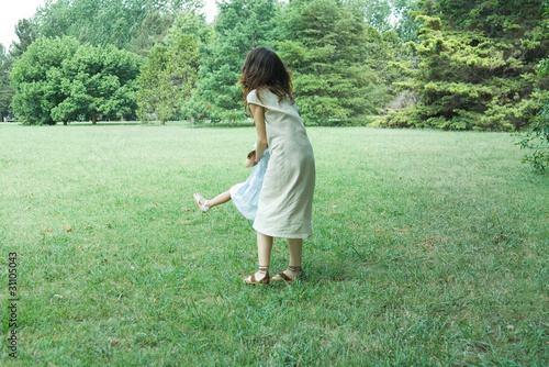 Photo: Woman swinging little girl around Woman swinging little girl around